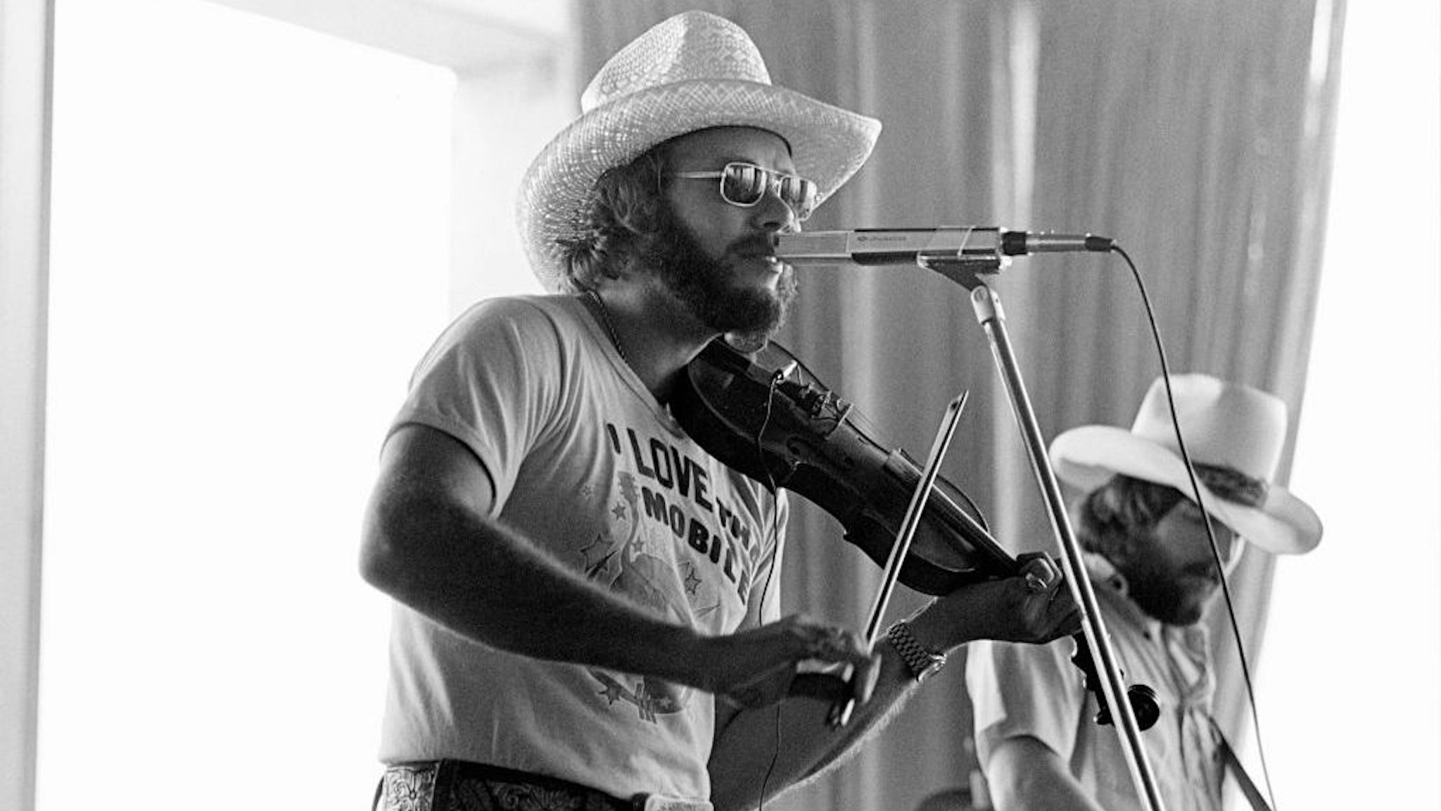 ATLANTA - MAY 26: Hank Williams Jr. performs for a record industry audience at Stouffer's Hotel on May 26, 1977 in Atlanta, Georgia. ( Photo by Tom Hill/Getty Images)