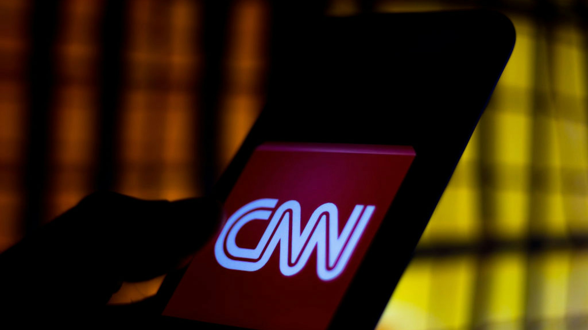 In this photo illustration a CNN logo seen displayed on a smartphone.