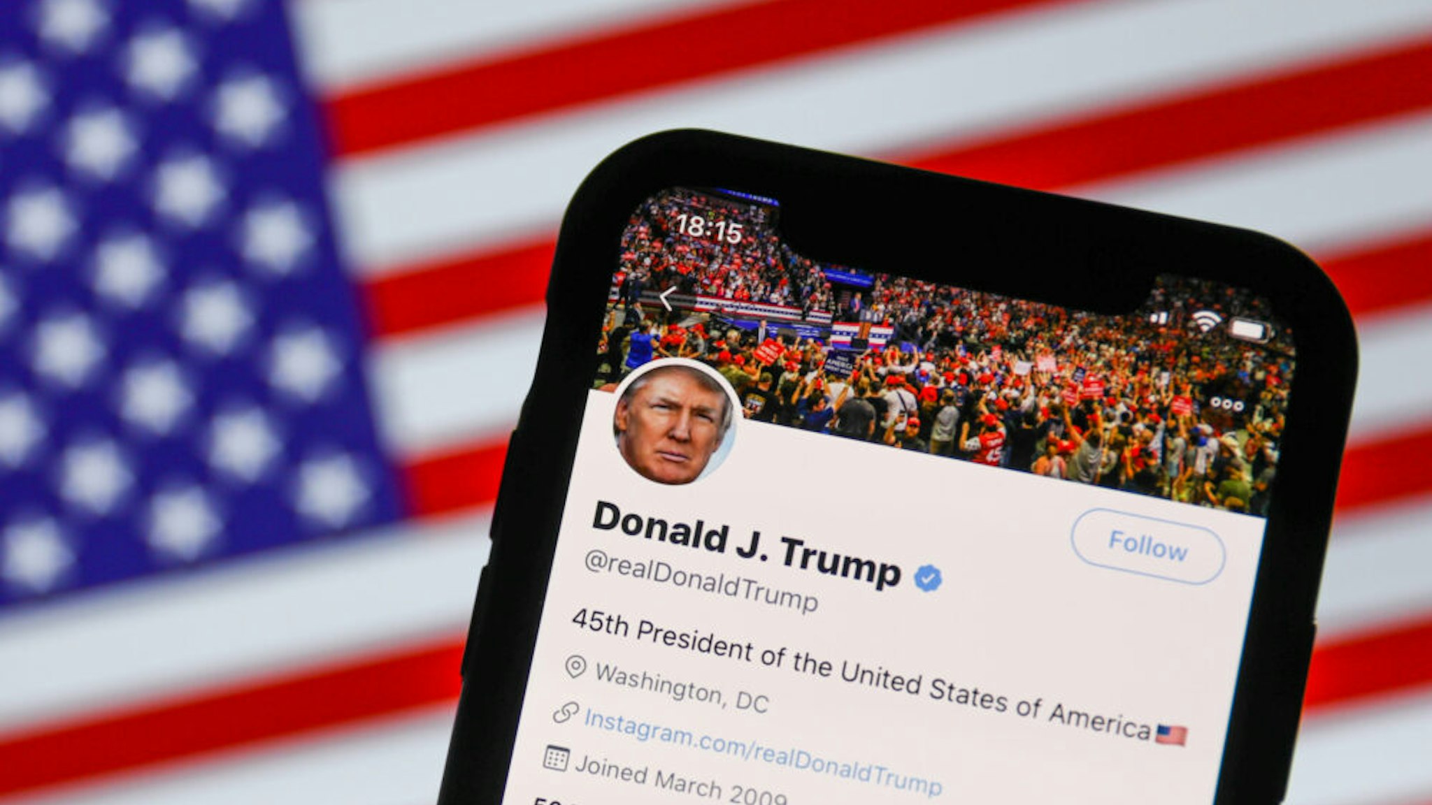 Twitter feed of the President of the USA Donald Trump is seen displayed on a phone screen with American flag in the background in this illustration photo taken on August 2, 2020. President of the USA Donald Trump said that Chinese app TikTok will be banned in the United States.