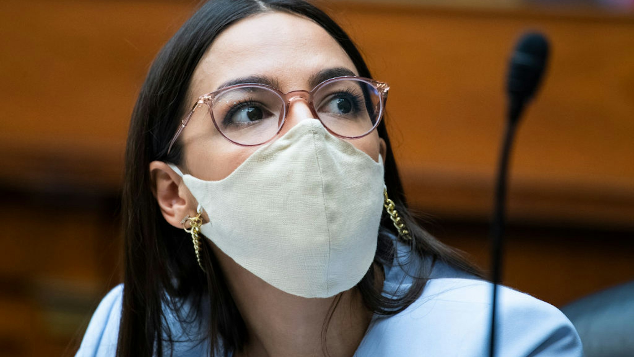 Representative Alexandria Ocasio-Cortez (D-NY), is seen as U.S. Postal Service Postmaster General Louis DeJoy testifies during a hearing before the House Oversight and Reform Committee on August 24, 2020 on Capitol Hill in Washington, DC.