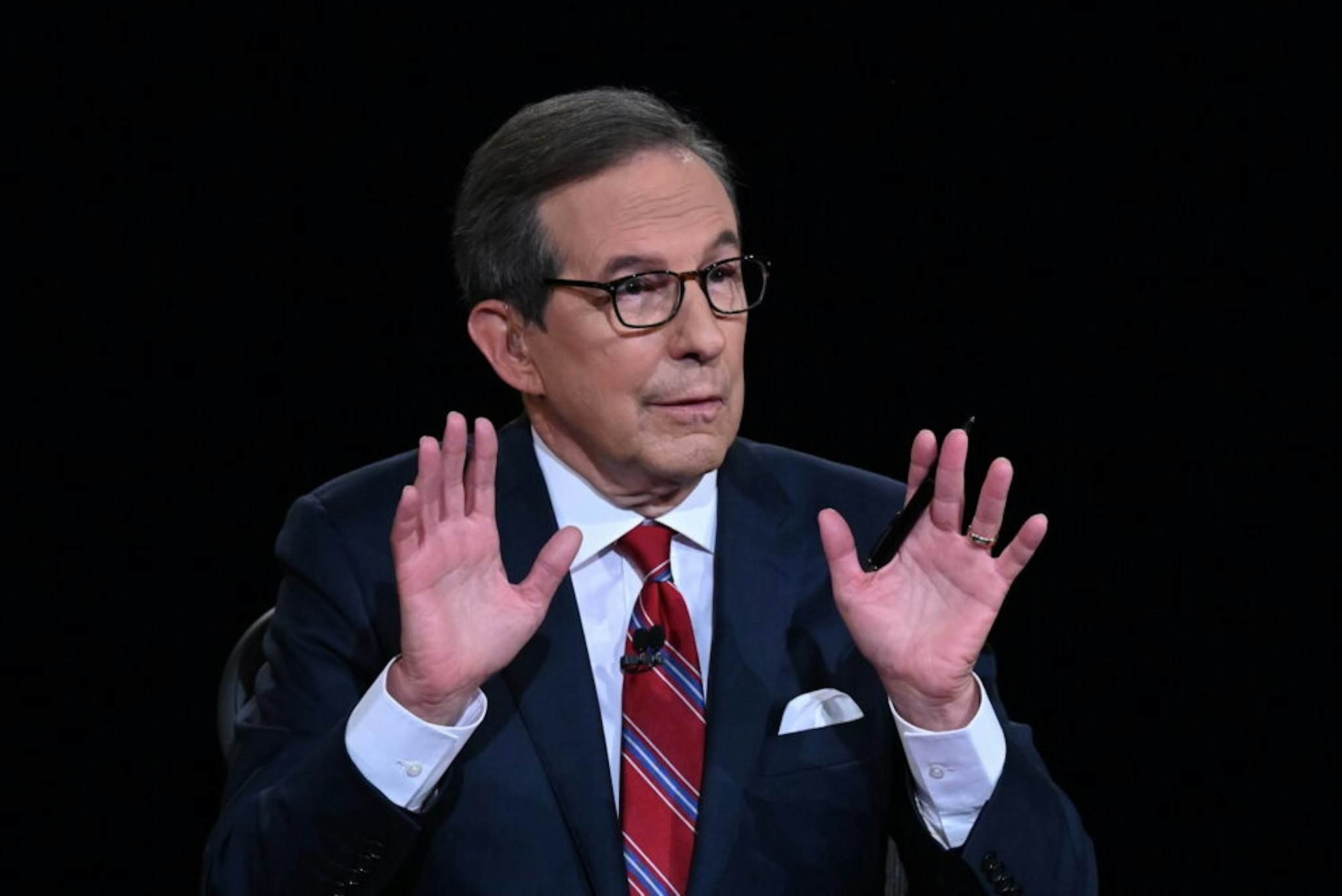 CLEVELAND, OHIO - SEPTEMBER 29: Debate moderator and Fox News anchor Chris Wallace directs the first presidential debate between U.S. President Donald Trump and Democratic presidential nominee Joe Biden at the Health Education Campus of Case Western Reserve University on September 29, 2020 in Cleveland, Ohio. This is the first of three planned debates between the two candidates in the lead up to the election on November 3.