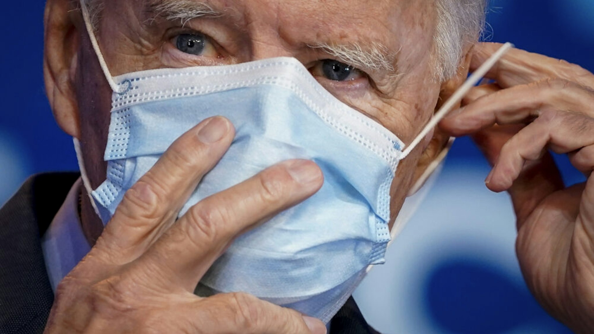 WILMINGTON, DE - OCTOBER 28: Democratic presidential nominee Joe Biden puts on his face mask after making remarks about the Affordable Care Act and COVID-19 after attending a virtual coronavirus briefing with medical experts at The Queen theater on October 28, 2020 in Wilmington, Delaware. Participants in the briefing include former U.S. Surgeon General Dr. Vivek Murthy, Director for Science in the Public Interest Dr. David Kessler, New York University professor Dr. Celine Grounder, and Yale University professor of medicine Dr. Marcella Nunez-Smith.