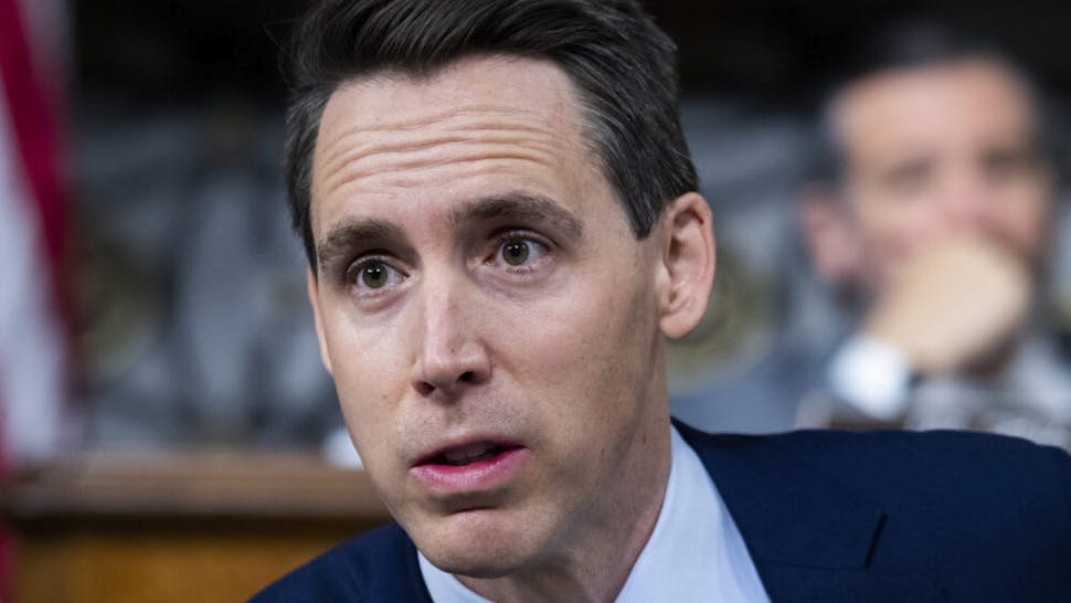 Josh Hawley UNITED STATES - DECEMBER 10: Sens. Josh Hawley, R-Mo., left, and Ted Cruz, R-Texas, attend the Senate Judiciary Committee markup on judicial nominations and the Online Content Policy Modernization Act, in Dirksen Building on Thursday, December 10, 2020.