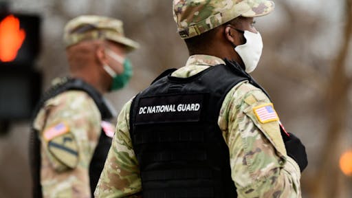 National Guard Activated In DC Ahead Of Expected Protests For Presidential Certification Members of the New York Army National Guards prepare to close a road near the White House in Washington, D.C., U.S., on Tuesday, Jan. 5, 2021. Washington's mayor, Muriel Bowser, urged residents not to engage with any protesters "seeking confrontation" and requested National Guard help in anticipation of potential violence in tied to protests as Congress meets to certify Joe Biden as the next U.S. president. Photographer: Erin Scott/Bloomberg via Getty Images