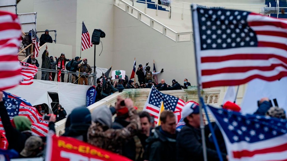 Supporters of US President Donald Trump clash with the US Capitol police during a riot at the US Capitol on January 6, 2021, in Washington, DC.