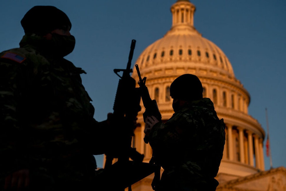 WASHINGTON, DC - JANUARY 13: Weapons are distributed to members of the National Guard outside the U.S. Capitol on January 13, 2021 in Washington, DC. Security has been increased throughout Washington following the breach of the U.S. Capitol last Wednesday, and leading up to the Presidential inauguration.