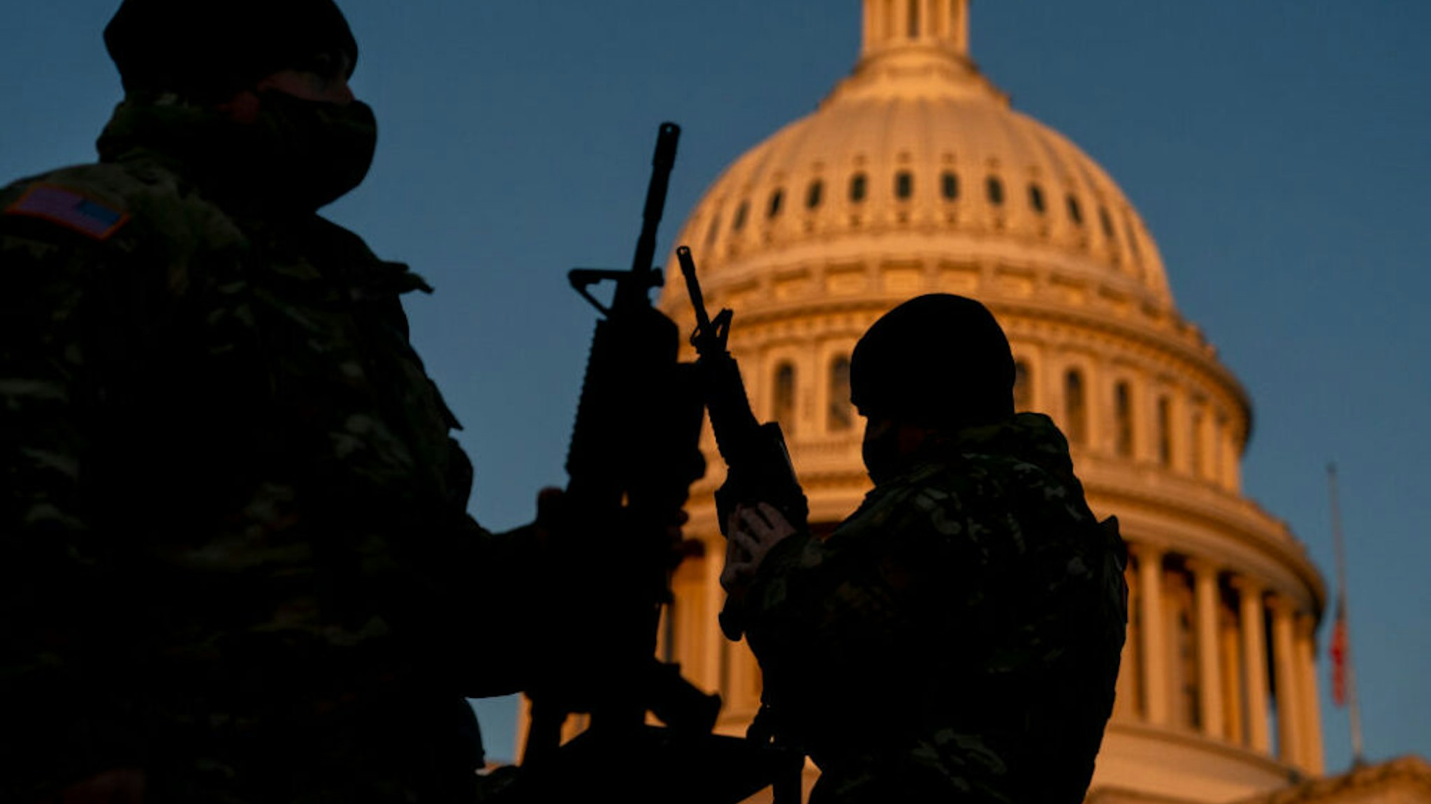 WASHINGTON, DC - JANUARY 13: Weapons are distributed to members of the National Guard outside the U.S. Capitol on January 13, 2021 in Washington, DC. Security has been increased throughout Washington following the breach of the U.S. Capitol last Wednesday, and leading up to the Presidential inauguration.