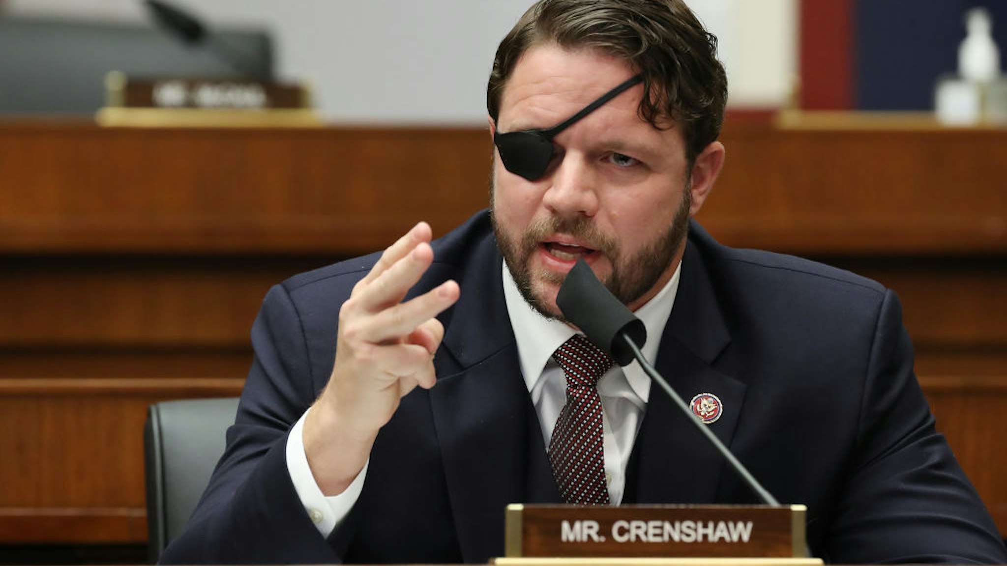 WASHINGTON, DC - SEPTEMBER 17: House Homeland Security Committee member Rep. Dan Crenshaw (R-TX) questions witnesses during a hearing on 'worldwide threats to the homeland' in the Rayburn House Office Building on Capitol Hill September 17, 2020 in Washington, DC. Committee Chairman Bennie Thompson (D-MS) said he would issue a subpoena for acting Homeland Security Secretary Chad Wolf after he did not show for the hearing. An August Government Accountability Office report found that Wolf's appointment by the Trump Administration, which has regularly skirted the Senate confirmation process, was invalid and a violation of the Federal Vacancies Reform Act. (Photo by Chip Somodevilla/Getty Images)