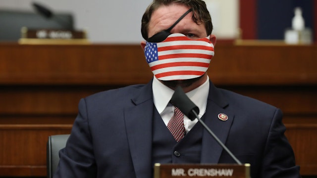 WASHINGTON, DC - SEPTEMBER 17: Wearing a face mask to reduce the risk posed by the coronavirus, House Homeland Security Committee member Rep. Dan Crenshaw (R-TX) attends a hearing on 'worldwide threats to the homeland' in the Rayburn House Office Building on Capitol Hill September 17, 2020 in Washington, DC. Committee Chairman Bennie Thompson (D-MS) said he would issue a subpoena for acting Homeland Security Secretary Chad Wolf after he did not show for the hearing. An August Government Accountability Office report found that Wolf's appointment by the Trump Administration, which has regularly skirted the Senate confirmation process, was invalid and a violation of the Federal Vacancies Reform Act. (Photo by Chip Somodevilla/Getty Images)
