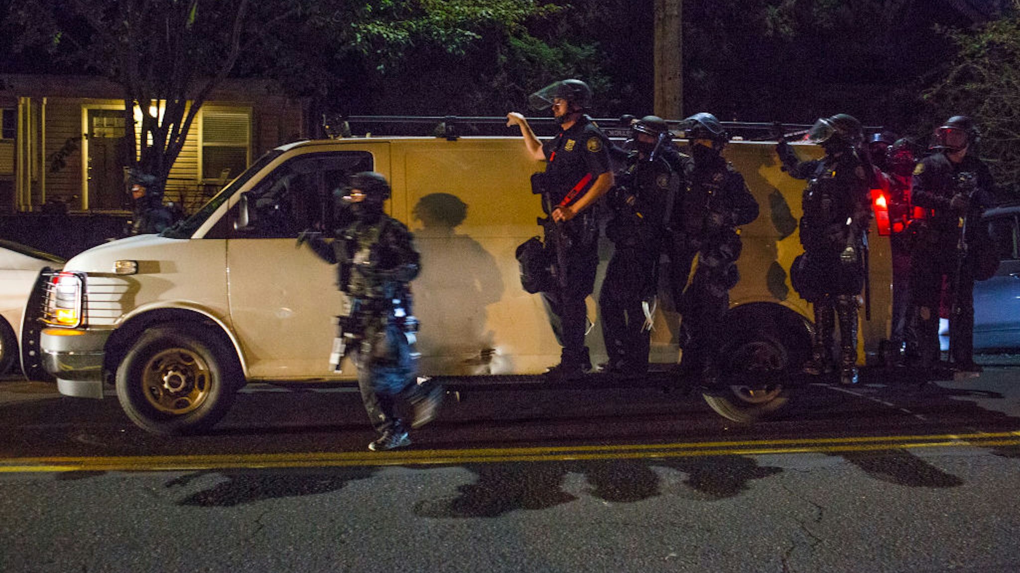 Portland police officers prepare to skirmish with protestors near the police union building on September 28, 2020 in North Portland, Oregon.