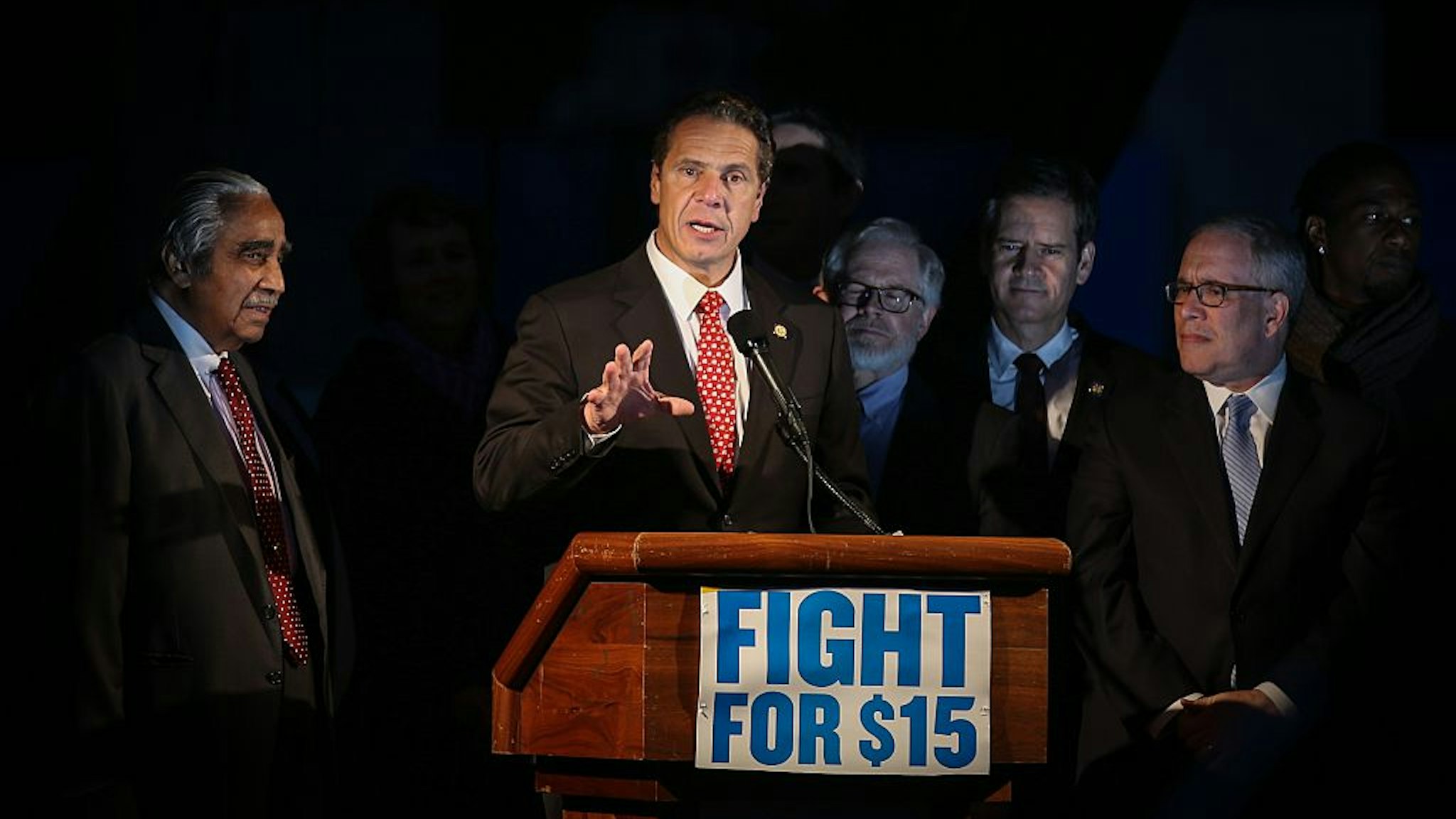 NEW YORK, NY - NOVEMBER 10: New York Governor Andrew Cuomo (C) speaks during as low wage workers and supporters protest for a $15 an hour minimum wage on November 10, 2015 at Foley Square in New York, United States. The protesters are demanding action from state legislators and presidential candidates to raise the minimum wage to $15 USD an hour. (Photo by Cem Ozdel/Anadolu Agency/Getty Images)
