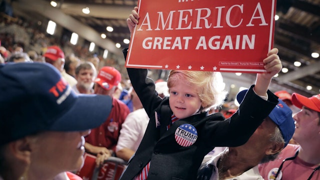 JACKSONVILLE, FL - NOVEMBER 03: Six-year-old Eli Townsend dresses like Republican presidential nominee Donald Trump during a campaign rally at the Jacksonville Equestrian Center November 3, 2016 in Jacksonville, Florida. With less than a week before Election Day in the United States, Trump and his opponent, Democratic presidential nominee Hillary Clinton, are campaigning in key battleground states that each must win to take the White House.