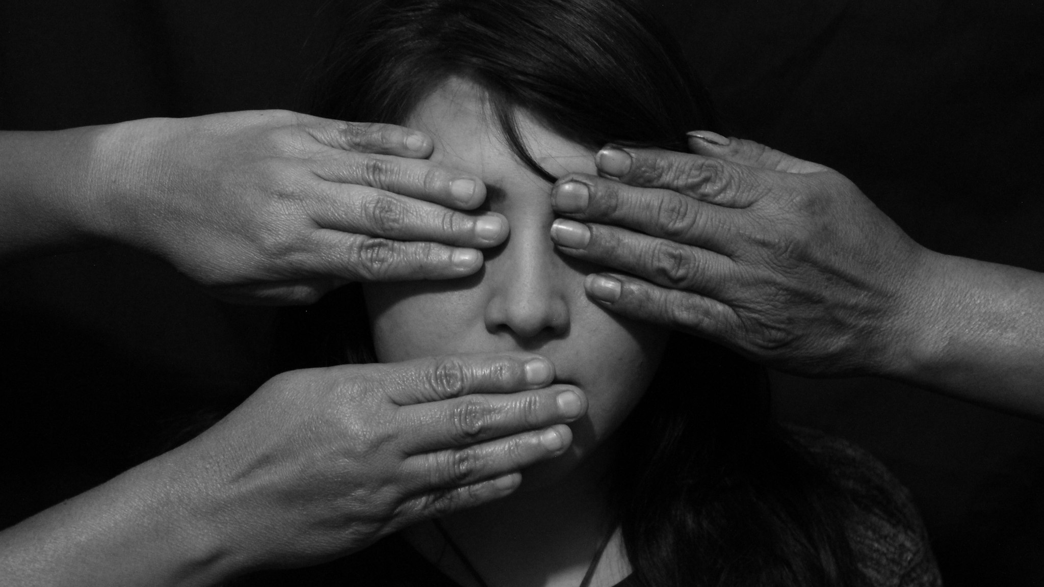 Close-Up Of A Hands On Womans Face - stock photo