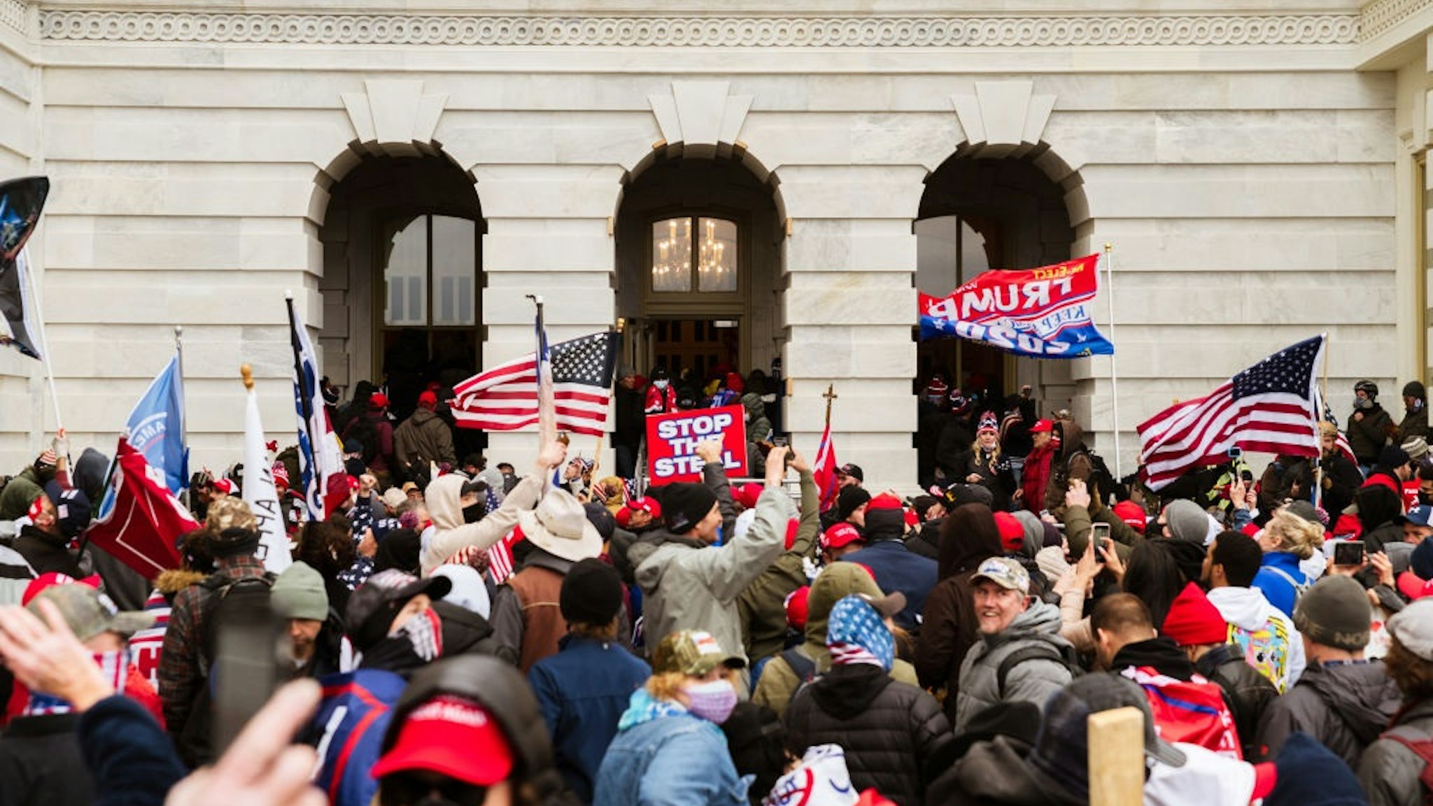 WASHINGTON, DC - JANUARY 06: A pro-Trump mob floods into the Capitol Building after breaking into it on January 6, 2021 in Washington, DC.
