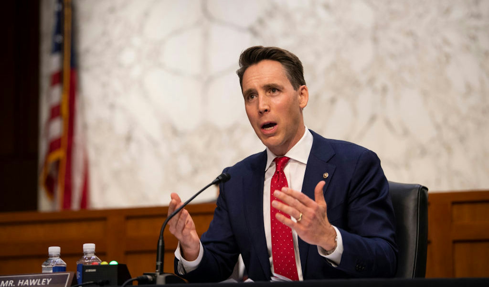 WASHINGTON, DC - OCTOBER 14: U.S. Sen. Josh Hawley (R-MO) questions Supreme Court nominee Judge Amy Coney Barrett as she testifies before the Senate Judiciary Committee on the third day of her Supreme Court confirmation hearing on Capitol Hill on October 14, 2020 in Washington, DC. Barrett was nominated by President Donald Trump to fill the vacancy left by Justice Ruth Bader Ginsburg who passed away in September. (Photo by Caroline Brehman-Pool/Getty Images)