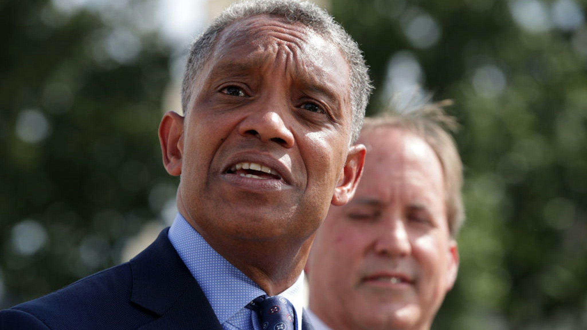 WASHINGTON, DC - SEPTEMBER 09: Attorney General of Washington, DC, Karl Racine speaks as Texas Attorney General Ken Paxton listens during a news conference in front of the U.S. Supreme Court September 9, 2019 in Washington, DC. Fifty state attorneys general are joining together to investigate Google’s possible antitrust violations. (Photo by Alex Wong/Getty Images)