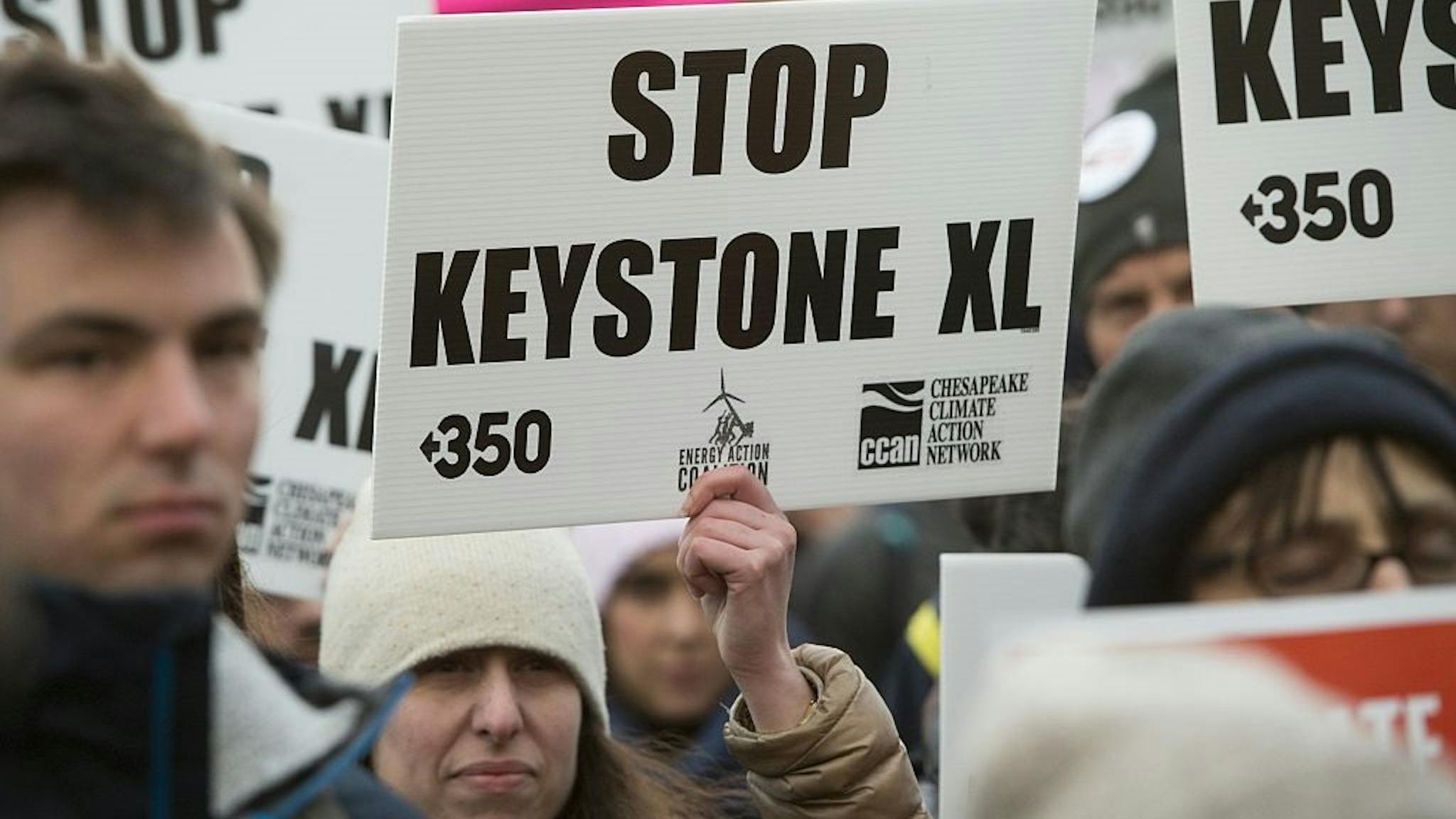 US-POLITICS-OIL-CANADA Opponents of the Keystone XL and Dakota Access pipelines hold a rally as they protest US President Donald Trump's executive orders advancing their construction, at Lafayette Park next to the White House in Washington, DC, on January 24, 2017.