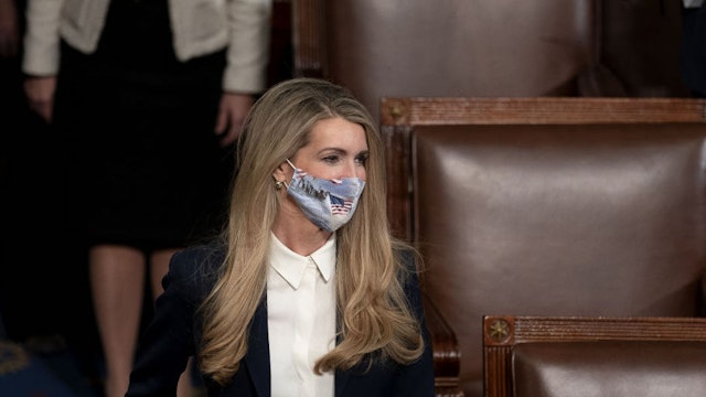 Senator Kelly Loeffler, a Republican from Goergia, wears a protective mask while arriving to a joint session of Congress to count the Electoral College votes of the 2020 presidential election in the House Chamber in Washington, D.C., U.S., on Wednesday, Jan. 6, 2021. The U.S. Capitol was placed under lockdown and Vice President Mike Pence left the floor of Congress as hundreds of protesters swarmed past barricades surrounding the building where lawmakers were debating Joe Biden's victory in the Electoral College.