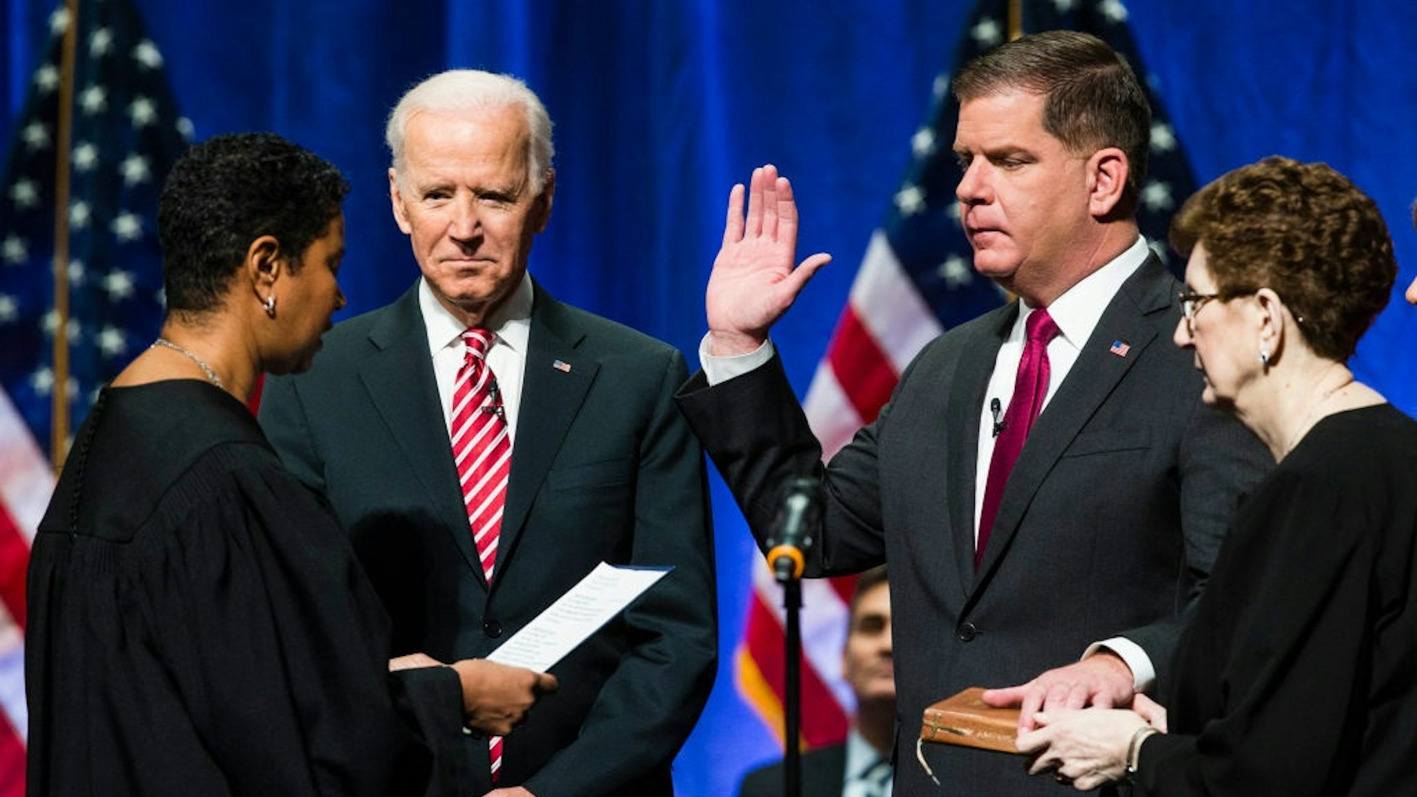 BOSTON, MA - JANUARY 2: Former U.S. Vice President Joe Biden watchers as Boston Mayor Martin J. Walsh is sworn in during his second inauguration in Boston on Jan. 2, 2018.