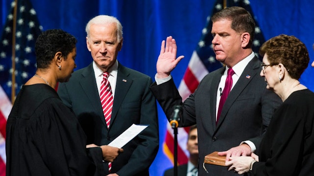 BOSTON, MA - JANUARY 2: Former U.S. Vice President Joe Biden watchers as Boston Mayor Martin J. Walsh is sworn in during his second inauguration in Boston on Jan. 2, 2018.