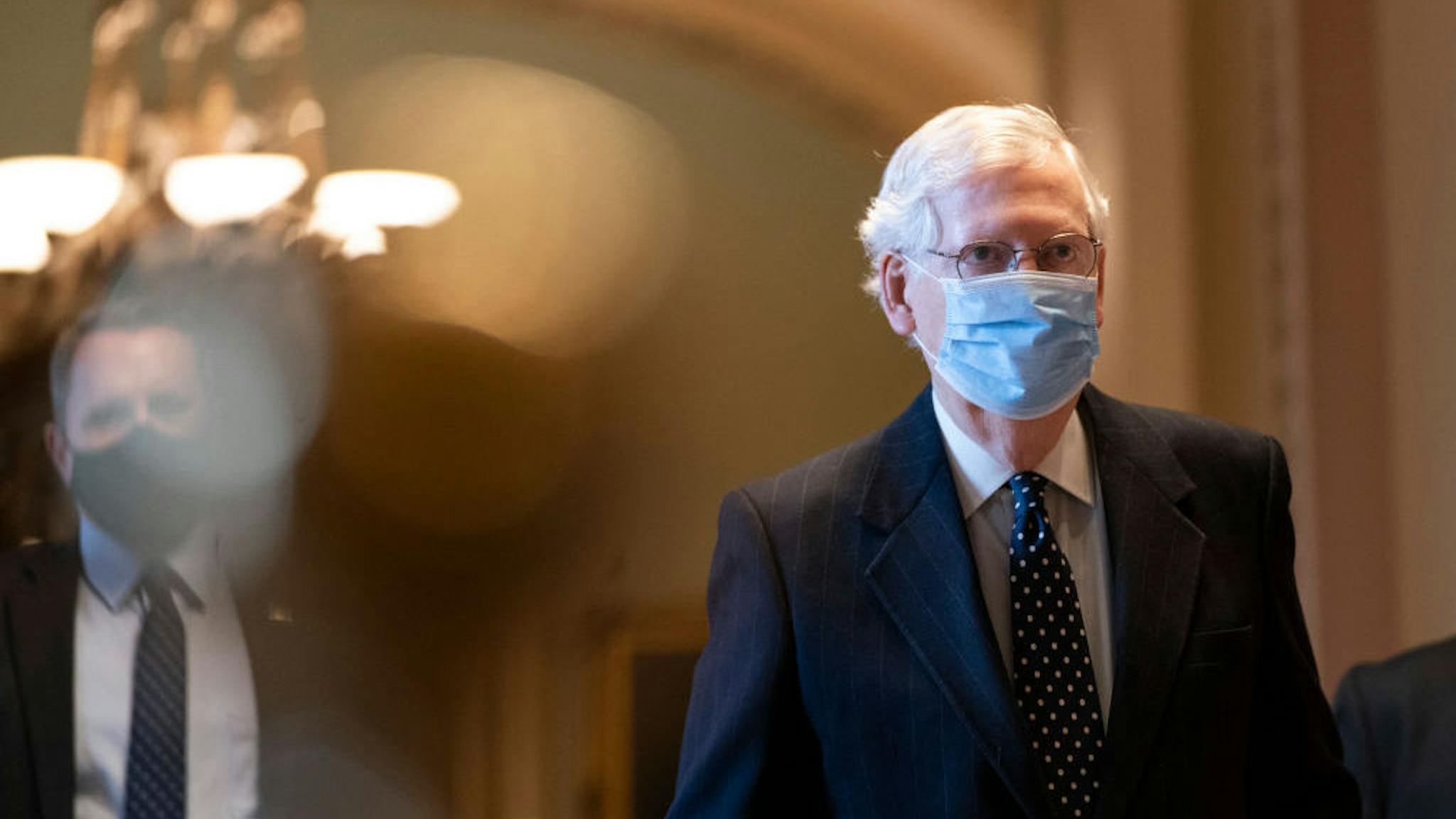 Mitch McConnell WASHINGTON, DC - JANUARY 06: Senate Majority Leader Mitch McConnell (R-KY) arrives at the U.S. Capitol and walks to his office on January 06, 2021 in Washington, DC. Congress held a joint session today to ratify President-elect Joe Biden's 306-232 Electoral College win over President Donald Trump. A group of Republican senators said they would reject the Electoral College votes of several states unless Congress appointed a commission to audit the election results. (Photo by Drew Angerer/Getty Images)