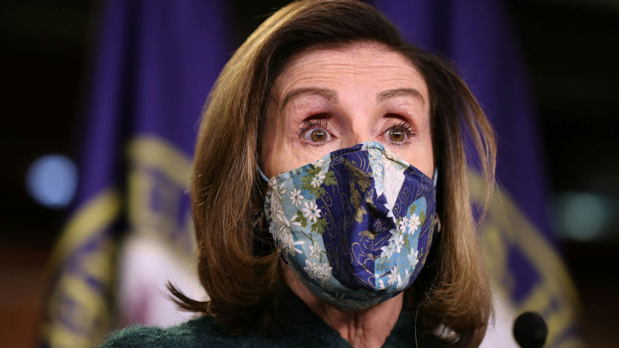 WASHINGTON, DC - JANUARY 28: Wearing a face mask to reduce the risk posed by the novel coronavirus pandemic, Speaker of the House Nancy Pelosi (D-CA) holds her weekly news conference in the U.S. Capitol Visitors Center January 28, 2021 in Washington, DC. When asked about what she means when she said Congress has an 'enemy within,' Pelosi said, 'It means that we have members of Congress who want to bring guns on the floor and have threatened violence on other members of Congress.' (Photo by Chip Somodevilla/Getty Images)