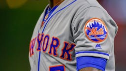 New York Mets PHILADELPHIA, PA - AUGUST 16: The New York Mets logo across the might arm of New York Mets shortstop Jose Reyes (7) during the MLB game between the New York Mets and the Philadelphia Phillies on August 16, 2018 at Citizens Bank Park in Philadelphia PA.
