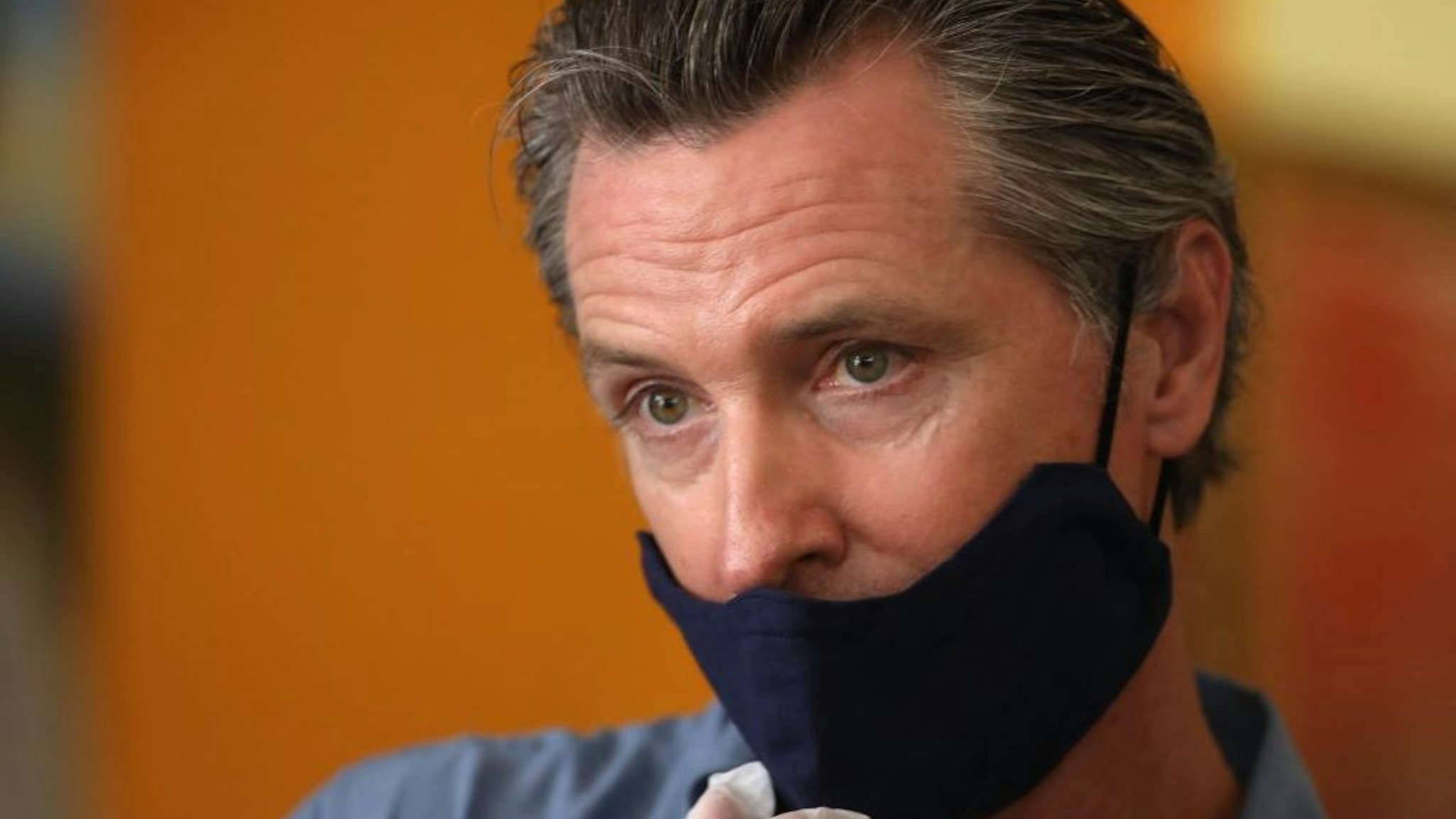 LOS ANGELES, CA - JUNE 03, 2020 - - California Governor Gavin Newsom is interviewed while visiting the Hot and Cool Cafe in Leimert Park after several days of protest in Los Angeles on June 3, 2020.
