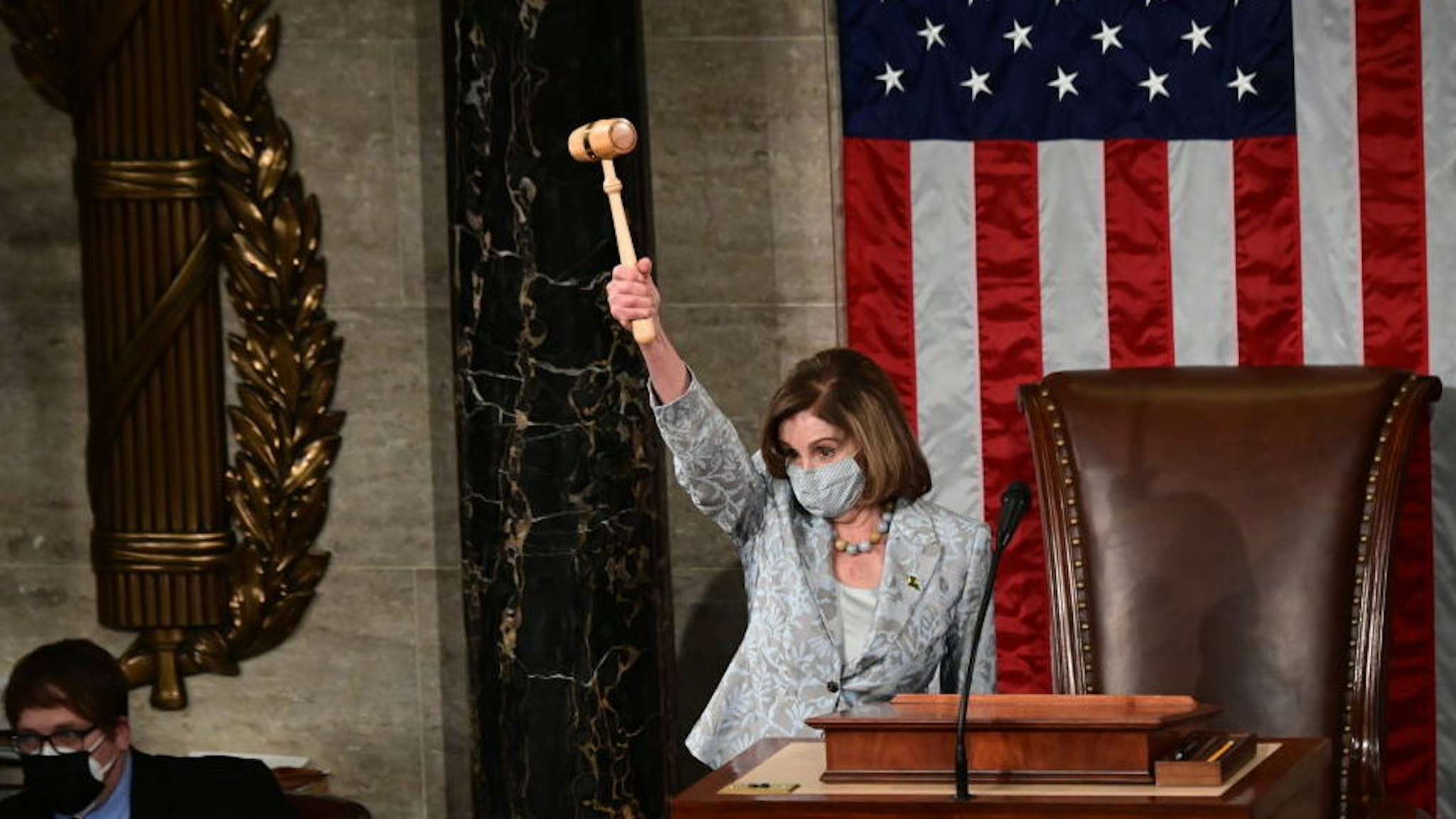 WASHINGTON, DC - JANUARY 03: U.S. House Speaker Nancy Pelosi (D-CA) presides over the year's opening session on January 3, 2021 in Washington, DC. Both chambers are holding rare Sunday sessions to open the new Congress as the Constitution requires.