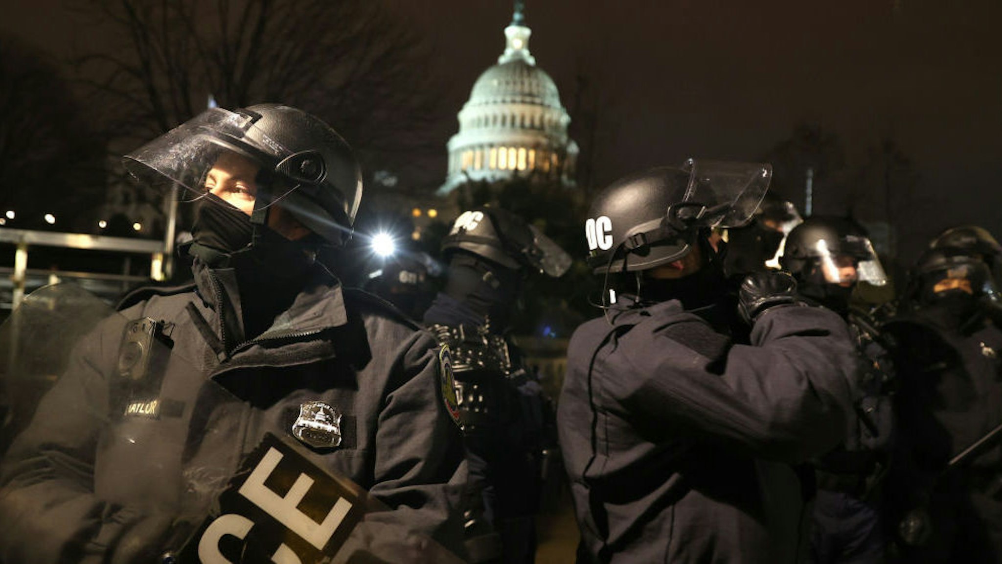 WASHINGTON, DC - JANUARY 06: Police officers in riot gear work to disperse protesters who are gathering at the U.S. Capitol Building on January 06, 2021 in Washington, DC. Pro-Trump protesters entered the U.S. Capitol building after mass demonstrations in the nation's capital during a joint session Congress to ratify President-elect Joe Biden's 306-232 Electoral College win over President Donald Trump.