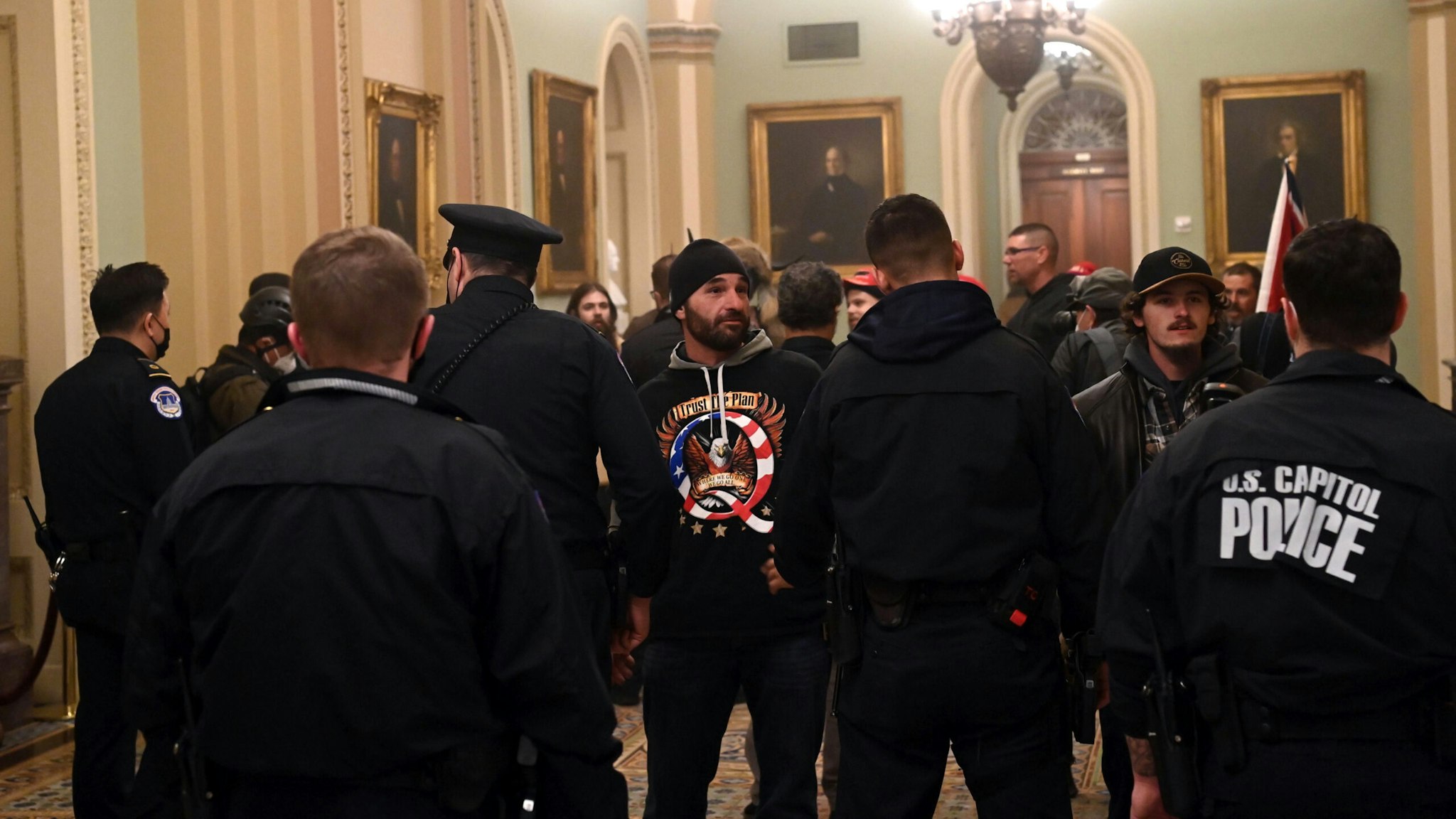 Supporters of US President Donald Trump enter the US Capitol on January 6, 2021, in Washington, DC. - Demonstrators breeched security and entered the Capitol as Congress debated the a 2020 presidential election Electoral Vote Certification.
