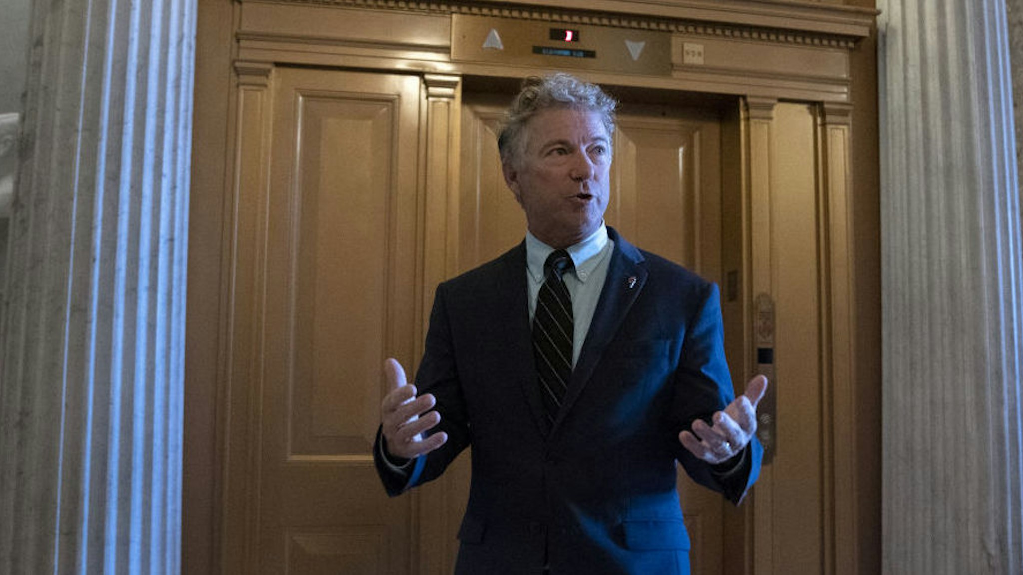 Senator Rand Paul, a Republican from Kentucky, walks to the Senate Chamber for a roll call vote at the U.S. Capitol in Washington, D.C., U.S. on Wednesday, Sept. 30, 2020. House leaders postponed a vote on a Democrat-only stimulus bill to give Treasury Secretary Steven Mnuchin and House Speaker Nancy Pelosi one more day to negotiate a compromise pandemic relief packag