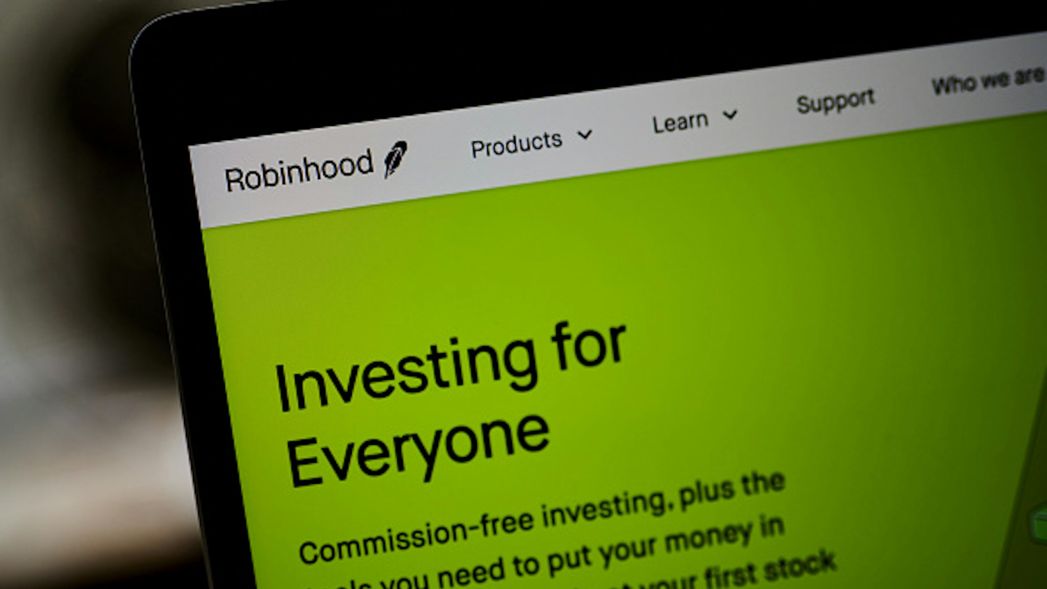 The Robinhood website home screen on a laptop computer arranged in the Brooklyn borough of New York, U.S., on Saturday, Dec. 19, 2020. Robinhood Markets will pay $65 million to settle allegations that it failed to properly inform clients it sold their stock orders to high-frequency traders and other firms, putting a major compliance headache behind the brokerage even as new ones emerge.
