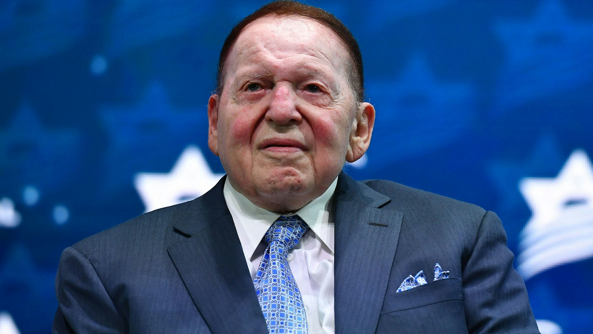 Philanthropist Chief Executive Officer of Las Vegas Sands Sheldon Adelson listens to US President Donald Trump address to the Israeli American Council National Summit 2019 at the Diplomat Beach Resort in Hollywood, Florida on December 7, 2019.