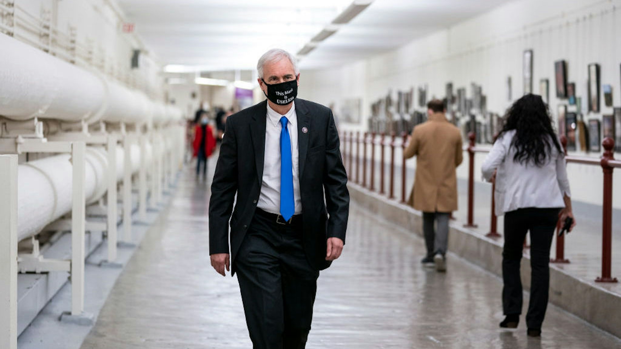 WASHINGTON, DC - JANUARY 12: Rep. Tom McClintock (R-CA) wears a protective mask while walking through the Canon Tunnel to the U.S. Capitol on January 12, 2021 in Washington, DC. Today the House of Representatives plans to vote on Rep. Jamie Raskin's (D-MD) resolution calling on Vice President Mike Pence to invoke the 25th Amendment, removing President Trump from office. On Wednesday, House Democrats plan on voting on articles of impeachment. (Photo by Stefani Reynolds/Getty Images)