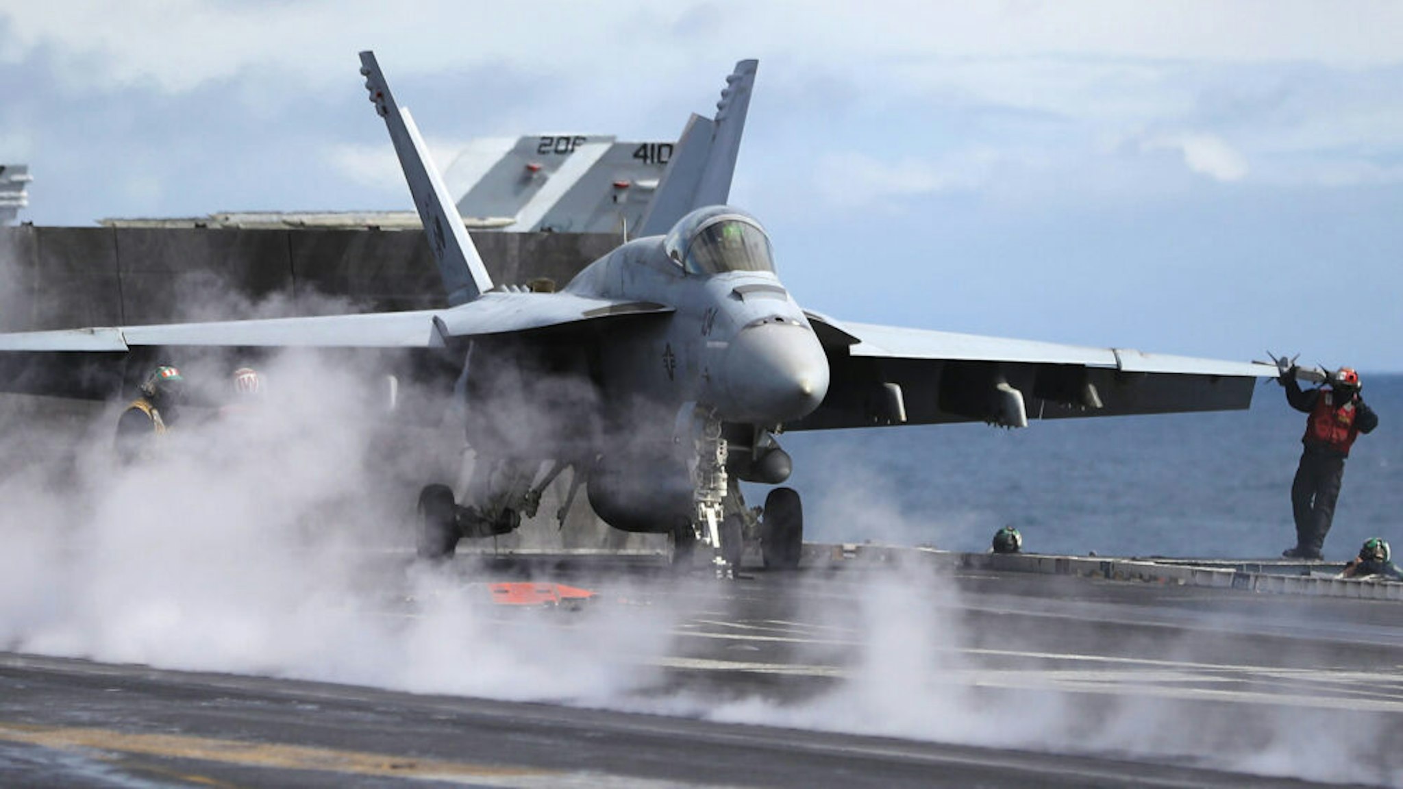 AT SEA, UNITED KINGDOM - AUGUST 06: An F/A-18 Hornet prepares for take off during joint military exercise, Saxon Warrior, aboard the USS George H.W. Bush on August 6, 2017 off the north west coast of the United Kingdom. The American Aircraft carrier the USS George HW Bush is a nuclear powered 97,000-tonne, 20 story high Nimitz class aircraft carrier. It has a 4.5-acre flight deck with around 80 combat aircraft and is home to around 5,000 US Navy personnel who are currently conducting joint military exercises off the coast of the United Kingdom.