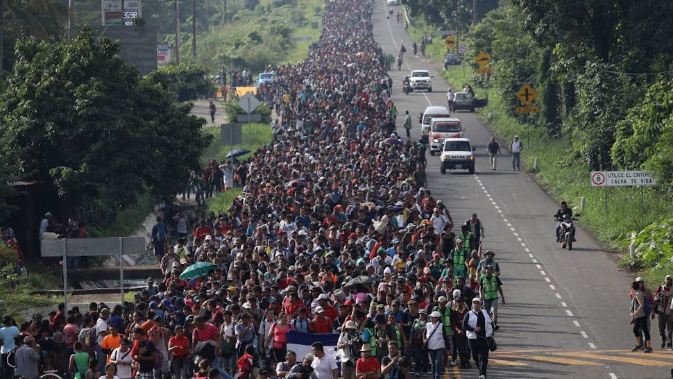 Migrant Caravan Crosses Into Mexico CIUDAD HIDALGO, MEXICO - OCTOBER 21: A migrant caravan walks into the interior of Mexico after crossing the Guatemalan border on October 21, 2018 near Ciudad Hidalgo, Mexico The caravan of Central Americans plans to eventually reach the United States. U.S. President Donald Trump has threatened to cancel the recent trade deal with Mexico and withhold aid to Central American countries if the caravan isn't stopped before reaching the U.S. (Photo by J