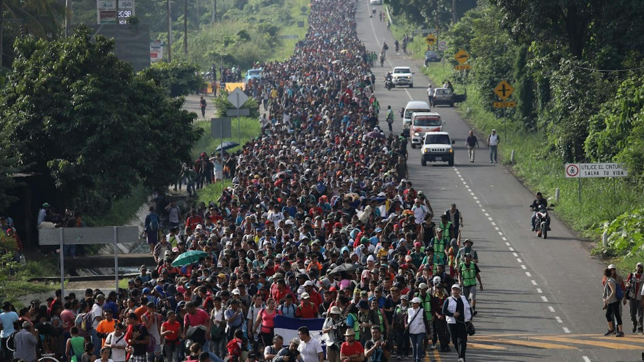 Migrant Caravan Crosses Into Mexico CIUDAD HIDALGO, MEXICO - OCTOBER 21: A migrant caravan walks into the interior of Mexico after crossing the Guatemalan border on October 21, 2018 near Ciudad Hidalgo, Mexico The caravan of Central Americans plans to eventually reach the United States. U.S. President Donald Trump has threatened to cancel the recent trade deal with Mexico and withhold aid to Central American countries if the caravan isn't stopped before reaching the U.S. (Photo by J