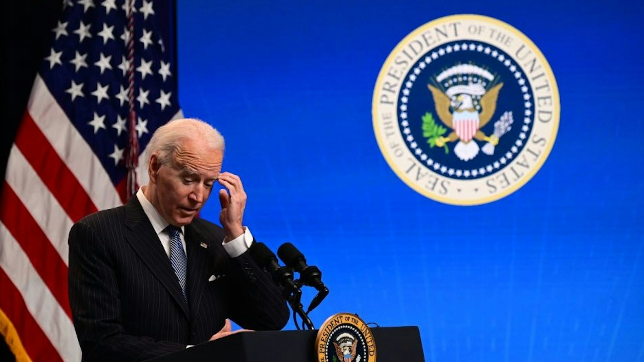 US President Joe Biden answers questions from the media after signing a "Made in America" Executive Order in the South Court Auditorium at the White House on January 25, 2021 in Washington, DC. (Photo by JIM WATSON / AFP) (Photo by