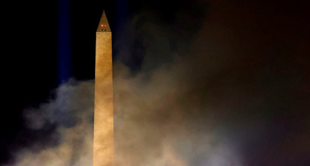 WASHINGTON, DC - JANUARY 20: Smoke lingers in the air around the Washington Monument after a fireworks show during an Inauguration Day event at the Lincoln Memorial on January 20, 2021 in Washington, DC. President Joe Biden and Vice President Kamala Harris were sworn in today. (Photo by