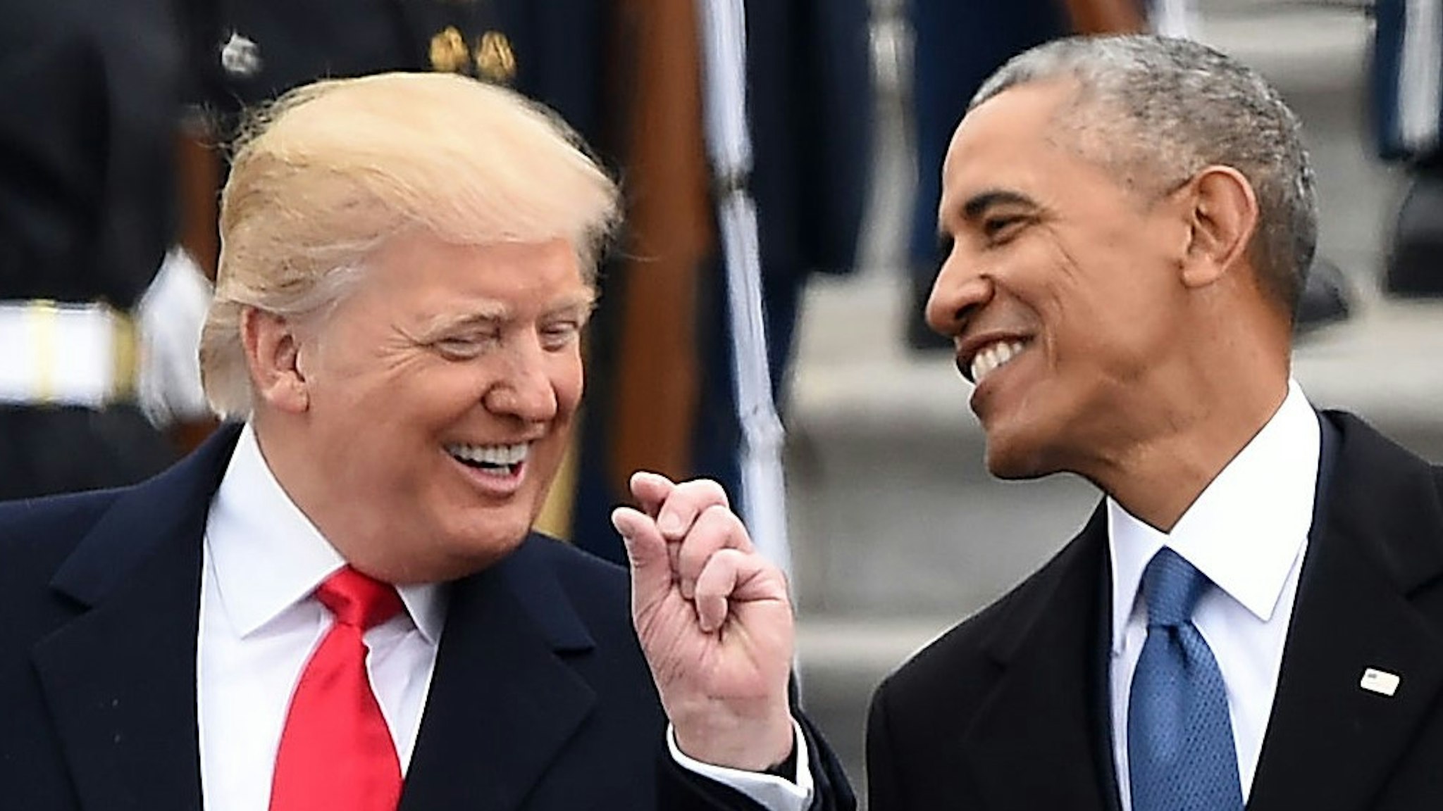 US President Donald Trump and former President Barack Obama talk on the East steps of the US Capitol after inauguration ceremonies on January 20, 2017, in Washington, DC. / AFP / Robyn BECK (Photo credit should read