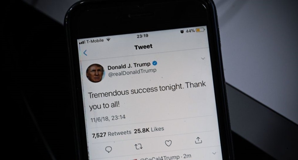 TOPSHOT - A smartphone shows a tweet by US President Donald Trump saying "Tremendous success tonight" after most of the result of the US midterm elections were called by US Media on November 06, 2018 in Washington, DC. - President Donald Trump called Tuesday's midterm congressional elections a "tremendous success," despite his Republican Party losing control of the House of Representatives. The Republicans held on to the Senate and narrowly survived a number of big individual races, including in Florida. The Democrats now control the lower house for the first time in eight years. (Photo by Eric BARADAT / AFP) (Photo credit should read