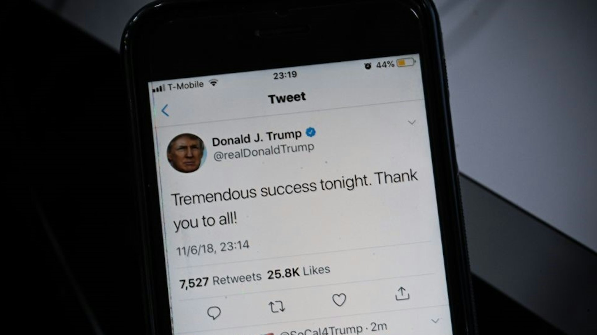 TOPSHOT - A smartphone shows a tweet by US President Donald Trump saying "Tremendous success tonight" after most of the result of the US midterm elections were called by US Media on November 06, 2018 in Washington, DC. - President Donald Trump called Tuesday's midterm congressional elections a "tremendous success," despite his Republican Party losing control of the House of Representatives. The Republicans held on to the Senate and narrowly survived a number of big individual races, including in Florida. The Democrats now control the lower house for the first time in eight years. (Photo by Eric BARADAT / AFP) (Photo credit should read