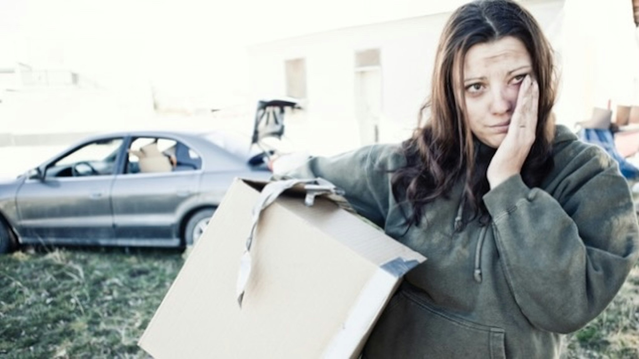 Homeless Woman Living Out of a Car - stock photo