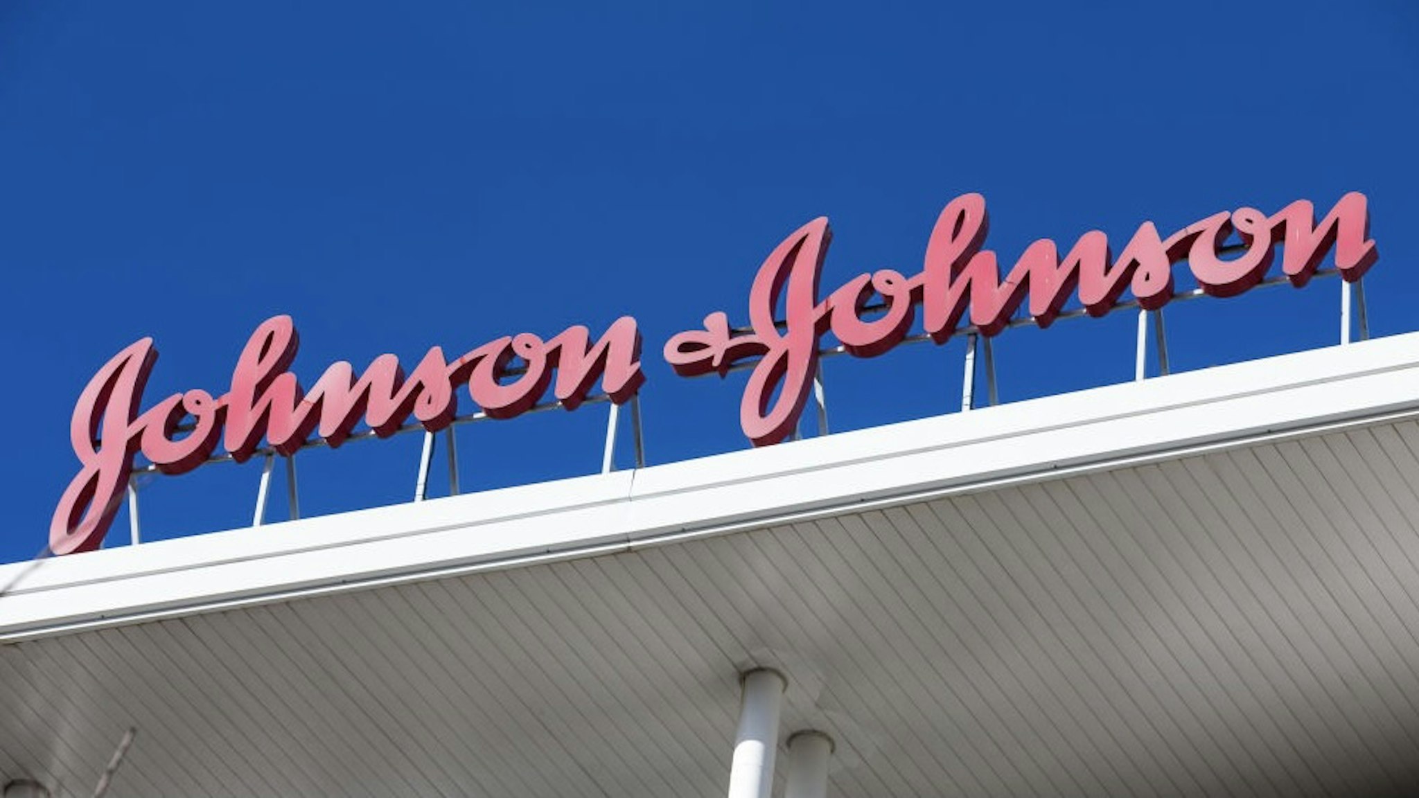 MADRID, SPAIN – NOVEMBER 19: A sign for Johnson &amp; Johnson is seen outside the Johnson &amp; Johnson headquarters on November 19, 2020 in Madrid, Spain. The Spanish Agency for Medicines and Health Products (AEMPS) has authorized the first phase 3 clinical trial on November 18, 2020 for the COVID-19 vaccine from the company Janssen, belonging to the American multinational Johnson &amp; Johnson. Trials of this vaccine had to be stopped due to "unexplained illness" in one participant. The tests were resumed eleven days later, after verifying that the event was not related to the administration of the drug. (Photo by David Benito/Getty Images)