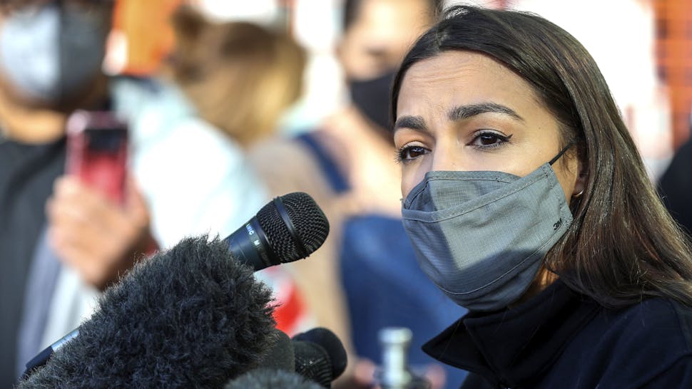 US-POLITICS-WEATHER Congresswoman Alexandria Ocasio-Cortez speaks to the media at the Houston Food Bank on February 20, 2021 in Houston, Texas. - The lawmakers address the weather disaster in Texas and helped distribute food at the food bank.