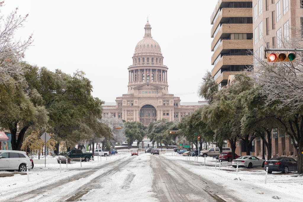 A snow covered road near the Texas State Capitol Building in Austin, Texas, U.S., on Wednesday, Feb. 17, 2021. The crisis that has knocked out power for days to millions of homes and businesses in Texas and across the central U.S. is getting worse, with blackouts expected to last until at least Thursday.