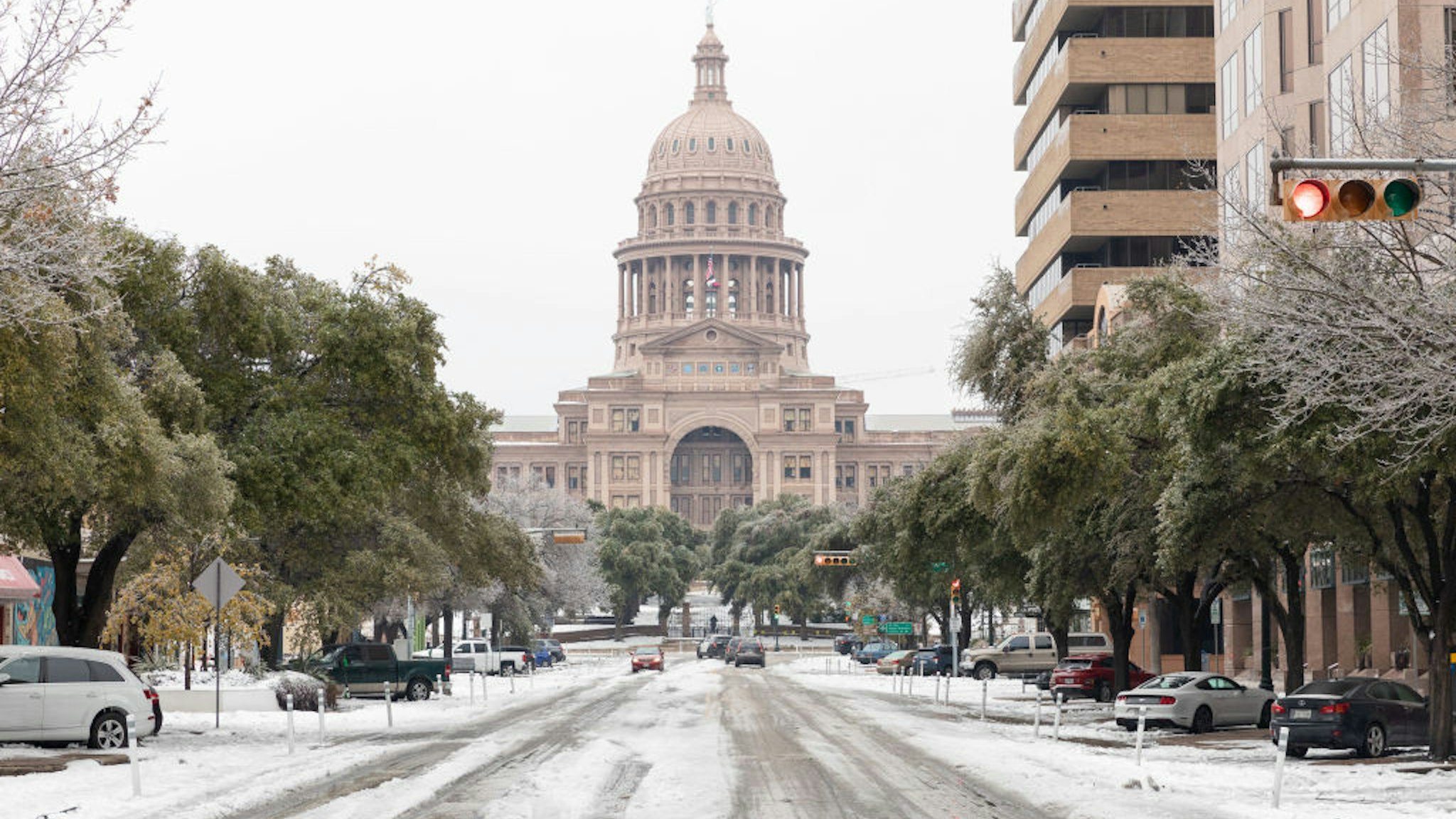 A snow covered road near the Texas State Capitol Building in Austin, Texas, U.S., on Wednesday, Feb. 17, 2021. The crisis that has knocked out power for days to millions of homes and businesses in Texas and across the central U.S. is getting worse, with blackouts expected to last until at least Thursday.