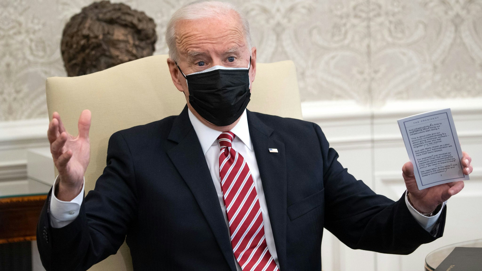US President Joe Biden speaks during a meeting with labor leaders about the American Rescue Plan, the administration's coronavirus response bill, in the Oval Office of the White House in Washington, DC, on February 17, 2021.