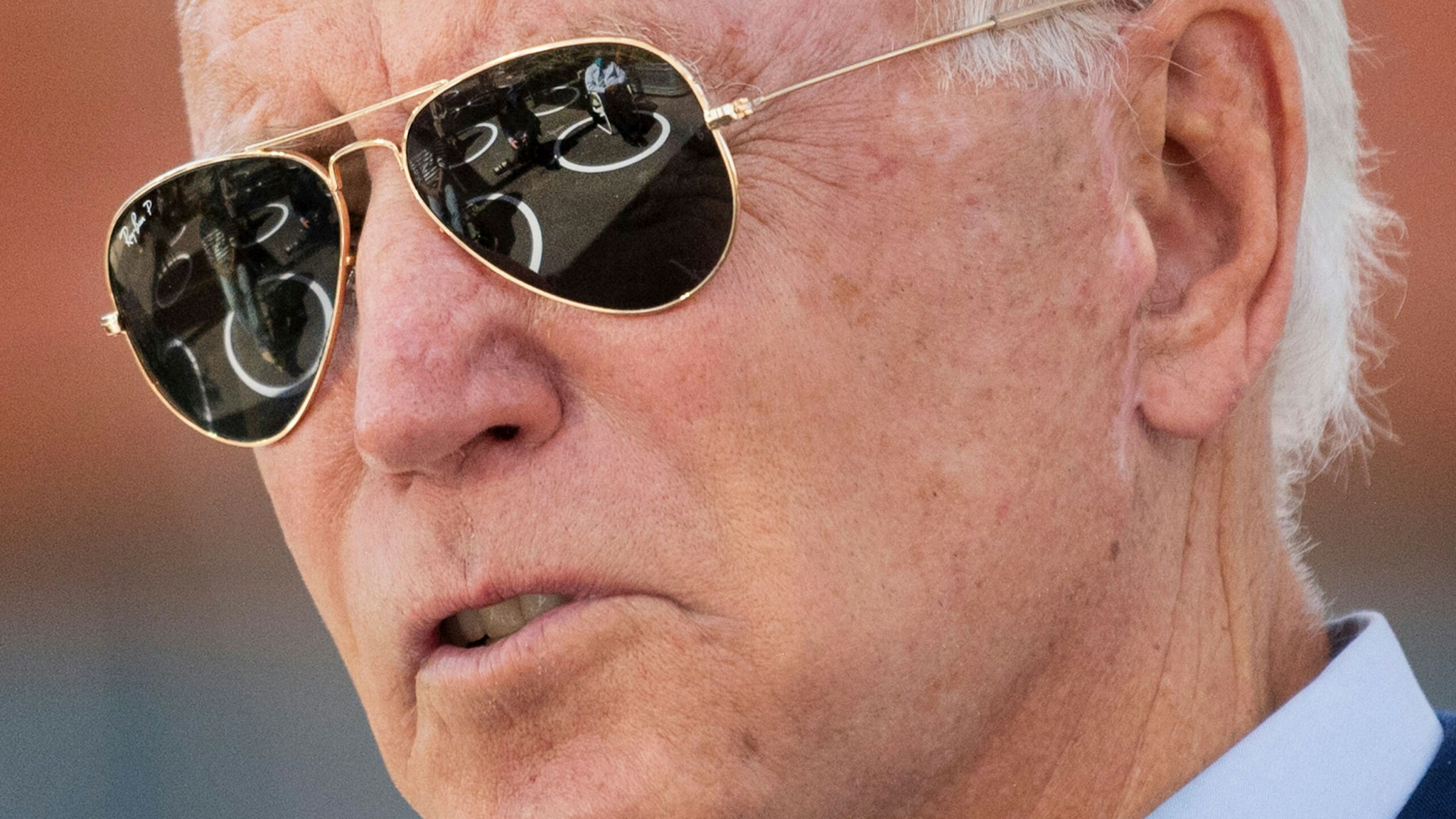 TOPSHOT - Socially distanced attendees are reflected in Democratic presidential candidate Joe Biden's sunglasses as he speaks at the Black Economic Summit at Camp North End in Charlotte, North Carolina, on September 23, 2020.